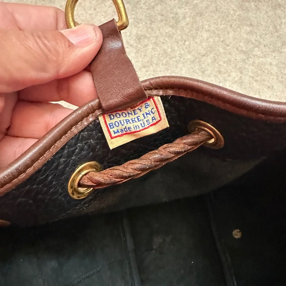 Vintage Dooney & Bourke Black w/Brown All Weather Leather Sling Small Backpack